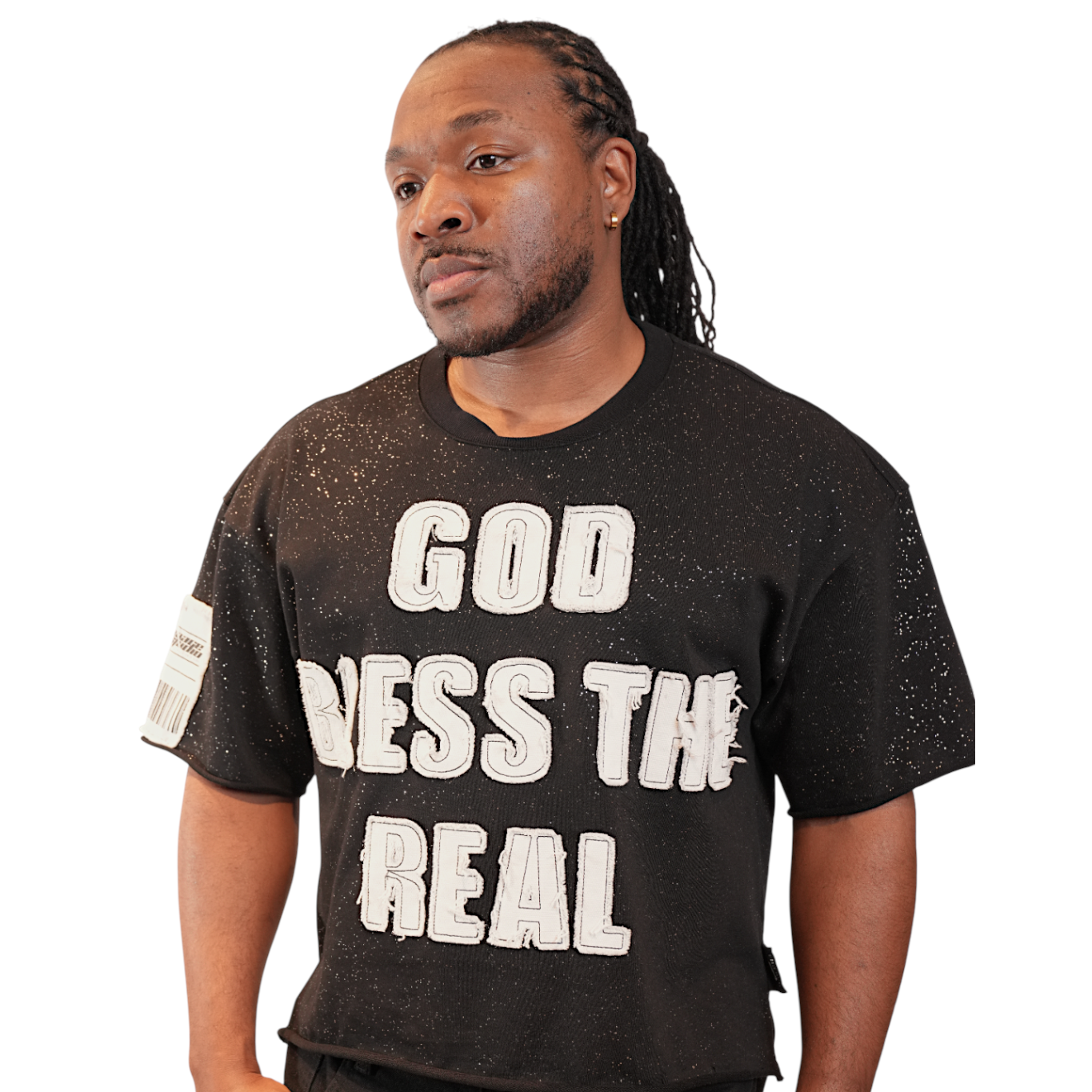 Man wearing a black t-shirt with text on a white background. God Bless The Real